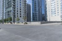 a city filled with lots of tall buildings on top of a gray concrete floor underneath blue sky