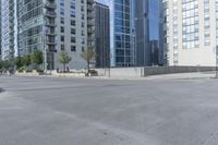 a city filled with lots of tall buildings on top of a gray concrete floor underneath blue sky