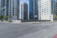 a city filled with lots of tall buildings on top of a gray concrete floor underneath blue sky