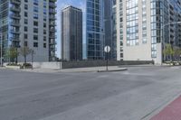 a city filled with lots of tall buildings on top of a gray concrete floor underneath blue sky