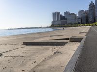 some people are jogging on the beach in chicago during the sun is rising over water