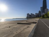 some people are jogging on the beach in chicago during the sun is rising over water