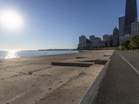 some people are jogging on the beach in chicago during the sun is rising over water