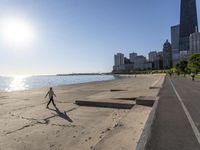 some people are jogging on the beach in chicago during the sun is rising over water