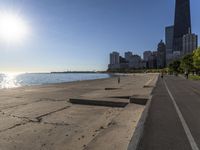 some people are jogging on the beach in chicago during the sun is rising over water