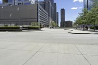 a picture of an empty street in a city in the daytime or at day, with a bench on the side
