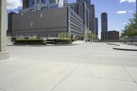 a picture of an empty street in a city in the daytime or at day, with a bench on the side