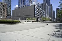a picture of an empty street in a city in the daytime or at day, with a bench on the side