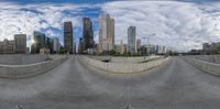 a wide angle panoramic view of city from a ramp and street level,