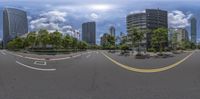 360 - ray fish - eye view of buildings on the streets and some green trees