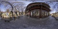 a fish - eye view of a park in china, looking through the front door