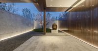 this entry features a white concrete staircase that leads to a light and wood accent wall