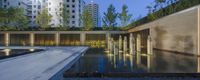 an outdoor pool is shown, the walkway has been built on one side with benches around it