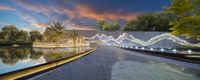 a fountain with water features lit up by colorful lights and is lighted in front of a beautiful sunset