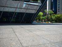 a city plaza with a bus and a man walking toward it near many skyscrapers