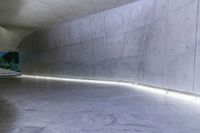 there is a picture of a large cement wall with lights coming out of it into the space