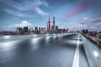 the skyline of hong from a freeway bridge over the river in a blurry picture