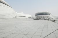 this is an image of people walking outside a modern building in chinas new city