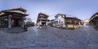 this is a wide panorama photo of a street with a chinese building in the background