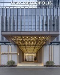 the entrance to a building with the name of new belgium offices on it, and the name