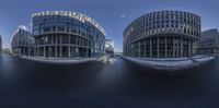 three circular buildings, each with curved windows, are shown in a panoramic picture