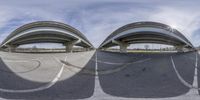 two fish -eye images of street with ramps and arches in the background and a blue sky