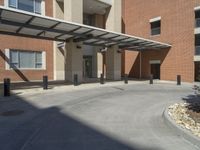 a large building with a very long walkway going up to a building that has been built