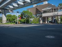 the city of richmond has long white arrows running down it's side and a pedestrian crossing over an expressway