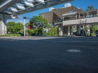 the city of richmond has long white arrows running down it's side and a pedestrian crossing over an expressway