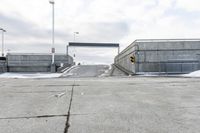 an open airway with snow covered ramps under it at the end of it