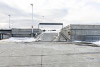 an open airway with snow covered ramps under it at the end of it