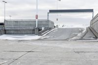 an open airway with snow covered ramps under it at the end of it