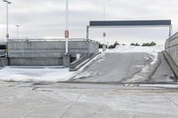 an open airway with snow covered ramps under it at the end of it