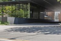 an image of the entrance to a building in the city area of a metropolis near the bus stop