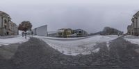 a blurry view of a large building with a snow covered slope in front of it