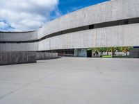 the building has been constructed into a concrete structure with several openings and curved walls and doors on either side