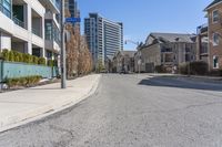 the residential area is very quiet, with houses lining both sides of the street in the distance