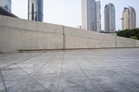 a large gray building with some concrete walls and a closed door in it's center