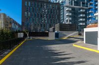 a lone fire hydrant in an empty parking lot area of a city center and business district