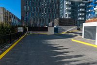 a lone fire hydrant in an empty parking lot area of a city center and business district