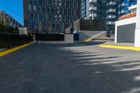 a lone fire hydrant in an empty parking lot area of a city center and business district