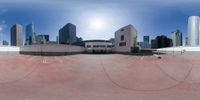 this 360 - panorama shot shows an empty parking lot in a city center with a view of buildings and skyscrapers