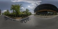 a picture taken from a fisheye lens of a street in a large city center