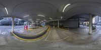 this image looks like a fisheye view of a parking lot in a city center