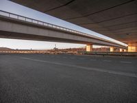 City at Dawn with Coastal Road and Bridge over Ocean