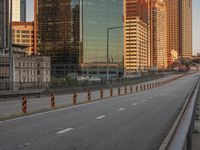 a freeway leads through the city from the roadway to the construction area of high rise buildings