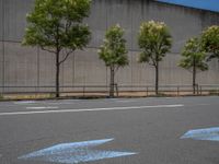 empty road with white lines on the streets of city area against cloudy blue sky on a sunny day