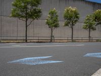 empty road with white lines on the streets of city area against cloudy blue sky on a sunny day