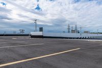 a picture of an empty parking lot during the day time and no cars in the way