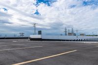 a picture of an empty parking lot during the day time and no cars in the way